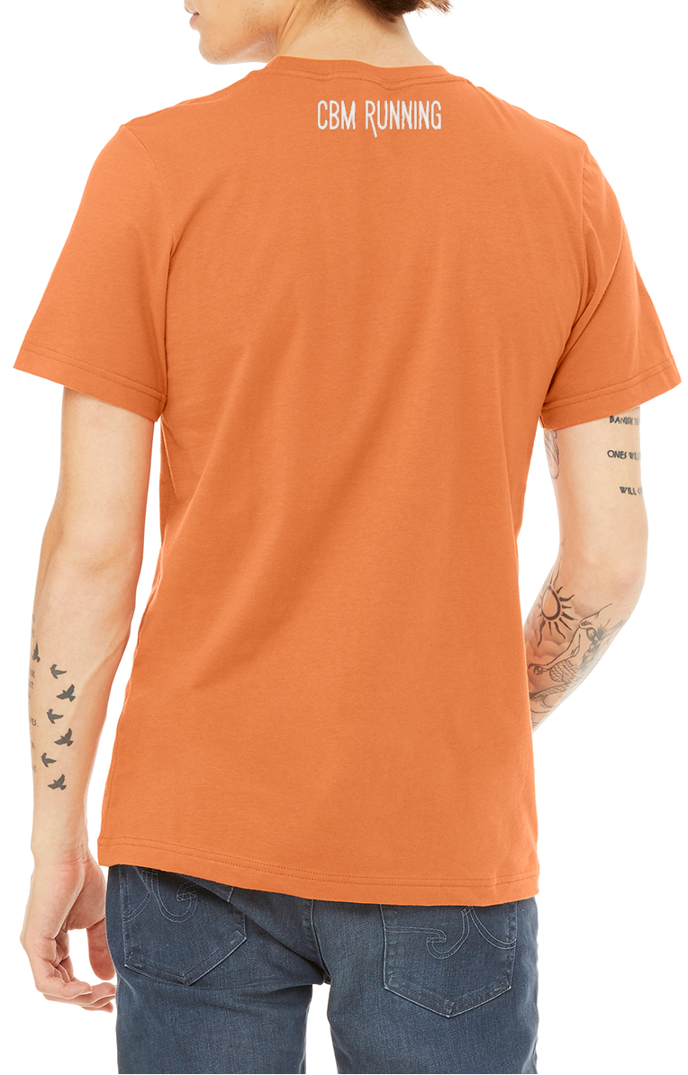 Person wearing an orange t-shirt with 'CBM Running' text on the back, standing against a white background.